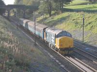 The upgraded cutting at Galgate is green again. 37403 <I>Isle of Mull</I> propels the 0515 Carlisle to Preston service south on 13th October 2016. [See image 55136] taken the previous April when the work had just been completed. <br><br>[Mark Bartlett 13/10/2016]