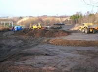 Work in progress thought to be in connection with the new ScotRail electric train depot at Millerhill on 15 December 2016 (?). View is north west from Whitehill Road towards Newcraighall station and the bridge carrying the A1 over the formation. <br><br>[John Furnevel 15/12/2016]