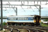 Railcar 153304 in Regional Railways livery passing Newcastle West Junction, between Central Station and the King Edward Bridge, on 5 April 1997. Redheugh Bridge carries road traffic across the Tyne in the background.<br><br>[John Furnevel 05/04/1997]