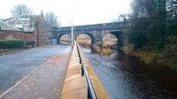 The original EL&N viaduct over the Water of Leith at Warriston, looking west along Warriston Road on 6 December 2016. The photograph shows a small section of the considerable flood prevention measures put in place along various stretches of the Water of Leith in recent years. For a comparison [see image 3215].<br><br>[Andy Furnevel 06/12/2016]