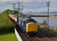 On-loan DRS 37703 enters Bo'ness with the closed Longannet Power Station in the background.  Due to a breach in the BKR by pipeline work, trains were being topped and tailed; on this occasion NCB no.19 brought up the rear.<br><br>[Bill Roberton 04/10/2016]