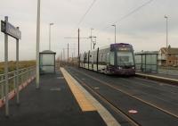 Norbreck North tram station only opened in March 2016 following a campaign by local residents. [See image 54358] taken during construction. The original stop closed in 2011 and, because this new station was constructed separately from the rest of the tramway upgrade, we know that this simple facility cost the tidy sum of £290,000. <I>Flexity</I> 002 <I>Alderman E. E. Wynne</I> calls at Norbreck North while heading south along the cliff top section.<br><br>[Mark Bartlett 10/12/2016]