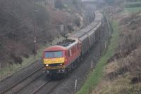The extra <I>Christmas Mail</I> trains have been running between Sheildmuir and Warrington again in 2016. DBS 90019 <I>Multimodal</I> and a rake of four wheeled cargo wagons trundle south through Forton at a steady 60mph, supplementing the Class 325 EPUs that provide the year round services. <br><br>[Mark Bartlett 15/12/2016]