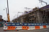 Looking west from Potato Wharf at the Castlefield Viaduct widening work on 15 December 2016. Note the new OLE stanchions which are angled in the way.<br><br>[John McIntyre 15/12/2016]