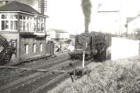 BR Standard light Pacific no 72009 <I>Clan Stewart</I> brings the 7.25am Stranraer - Glasgow train over Dunragit level crossing on 16 July 1956.<br><br>[G H Robin collection by courtesy of the Mitchell Library, Glasgow 16/07/1956]