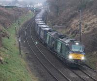 DRRS 68018 <I>Vigilant</I> and 68017 <I>Hornet</I> power through the curves between Scorton and Bay Horse with the northbound <I>Tesco Express</I> on a gloomy 15th December 2016. The train is approaching Cleveley Bank Lane bridge. <br><br>[Mark Bartlett 15/12/2016]