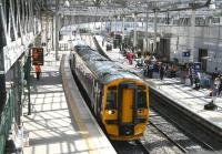 The ScotRail 1239 service to Perth sets out on its journey from the east end of platform 1 at Waverley on a bright and sunny 19 July 2016. One of the benefits of the major roof panel replacement programme carried out at the station between 2011 and 2013 can be seen here to good effect [see image 36223].<br><br>[John Furnevel 19/07/2016]