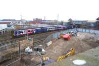 A Manchester bound train enters platform 3 at Bolton station on 15 December 2016. The area in the foreground will see track once again when platform 5 is reinstated as part of the electrification works between Manchester and Euxton Jct.<br><br>[John McIntyre 15/12/2016]