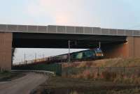 Another day - another <I>Northern Belle Christmas Diner</I>. 68016 <I>Fearless</I> heads an excursion from Crewe and Liverpool under the newly opened <I>Bay Gateway</I> bridge near Morecambe South Junction [See image 50297]. The train had just visited the Hellifield to Carnforth line and earlier in the day it had also traversed the rarely used Halton Curve near Runcorn.<br><br>[Mark Bartlett 20/12/2016]