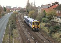 Running on the former four track section of line between Fylde Junction and Kirkham, 158908 forms a York to Blackpool North service seen leaving Preston on 22nd November 2016. The old <I>Fast Lines</I> are now occupied by the <I>Tom Benson Way</I> ring road at this point.  <br><br>[Mark Bartlett 22/11/2016]