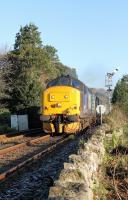 DRS 37425 accelerates away from Grange-over-Sands station heading for Barrow-in-Furness with 2C47 from Preston on a very sunny 28th December 2016. <br><br>[Mark Bartlett 28/12/2016]