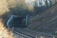 Looking east towards the 16 Chorley Arches that keep the cutting walls apart. The Chorley Tunnel is just beyond the bend to the right and traffic on the A6 at Hartwood Roundabout can be seen through the trees towards the top right<br><br>[John McIntyre 01/01/2017]