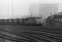 An unidentified Class 56, in <I>Rail Blue</I> livery, rumbles past Saltley with a loaded MGR train in January 1981. [Ref query 435]<br><br>[Mark Bartlett 21/01/1981]