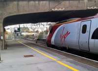 An up Pendolino seems to be staring wistfully at the former signal box and the non-electrified Leamington line.<br><br>[Ken Strachan 26/11/2016]