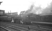 Britannia 70044 <I>Earl Haig</I> at Carlisle platform 4 on 11 July 1964. The Pacific has just taken over the 10.35am summer Saturday Glasgow Central - Blackpool Central.  <br><br>[K A Gray 11/07/1964]