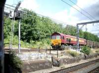 EWS 59201 brings an empty stone train returning to the west country slowly down the ramp from Acton Wells Junction as it moves from the North London Line to the Great Western main line in July 2005. Grab shot from a passing Heathrow Express bound for Paddington. <br><br>[John Furnevel 20/07/2005]