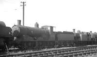 A lineup of steam locomotives awaiting disposal at Eastleigh in September 1963 includes Drummond ex-LSWR '700' class no 30368. Built by Dubs & Co at their Polmadie works in 1897, the 0-6-0 had been withdrawn from 70D Basingstoke at the end of 1962. It was eventually cut up at Eastleigh in December 1963.<br><br>[K A Gray 25/09/1963]