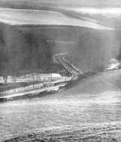 The railway bridge that carried the Selkirk branch over the River Tweed at Ettrickfoot, thought to have been taken in the early 1960s. The branch closed completely in 1964 and the bridge was subsequently demolished [see image 56256]. <br><br>[Dougie Squance (Courtesy Bruce McCartney) //]