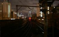 An evening view from the western end of platforms 13/14 at Manchester Piccadilly looking towards Oxford Road. In the distance are the tail lights of an ATW DMU waiting to proceed as both signals above it are at danger. Over the extended Christmas and New Year possession signalling improvements were introduced to allow bi-directional running on these lines through to Ordsall Jct.<br><br>[John McIntyre 10/01/2017]