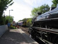 The afternoon Jacobite to Mallaig crosses a ScotRail service at<br>
Arisaig on 3rd June 2016.<br><br>[David Spaven 03/06/2016]