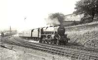 Class 5 4-6-0 44795 passing Corsebar Junction and approaching Paisley West with a Largs - St Enoch train on 2 September 1957. In the background Horwich Mogul 42914 is standing in the loop on the Potterhill Branch. [Ref query 516]  <br><br>[G H Robin collection by courtesy of the Mitchell Library, Glasgow 02/09/1957]