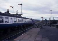 40060 takes the Perth route at Ladybank (North) Junction on 7th July 1978.  The layout here was altered during October 1980 when the signalbox was abolished and colour light signalling installed.<br>
<br>
When the junction was remodelled in 1980 one of the principal aims was to raise the speed limits for traffic entering and exiting the Perth route.  The original crossover was on canted track which caused a severe restriction to southbound traffic.  I cannot recall the previous speed limit but Up trains are now permitted to travel at 50mph.  Previously Perth bound trains were all routed via the Down Branch loop and again speed was severely limited.  Today Perth bound traffic is permitted through Ladybank at 70mph.<br><br>[Graeme Blair 07/07/1978]