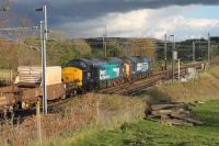 DRS 37604 (leading) and 37069 on the embankment south of Bay Horse station with the evening flasks from Sellafield to Crewe on 27th April 2016. DRS put six Class 37s up for sale during 2016 but these two were not offered at that time and remain in service. <br><br>[Mark Bartlett 27/04/2016]