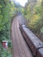 A Class 37 propels a Black 5-hauled charter to Tweedbank up the bank at Craiglockhart on the Sub on 9th October 2016.<br><br>[David Spaven 09/10/2016]