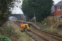 Rerailing complete, moving the old jointed rail out of the way is taking place at Croston on the afternoon of 22 January 2017. It is understood that around 2Km was replaced in total which should make the journey by Pacer a little more comfortable.<br><br>[John McIntyre 22/01/2017]