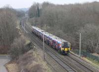 TPE 350404 heads away from Lancaster with a Manchester Airport to Edinburgh service on 24th January 2017. The train is seen looking south towards Lancaster from the new vantage point of the <I>Bay Gateway</I> bridge that opened in October 2016 [See image 54841]. [Ref query 617] <br><br>[Mark Bartlett 24/01/2017]