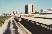 A Westrail DMU at one of the narrow gauge (1067mm) suburban platforms on the south side of East Perth Station. The adjacent sidings were evidently where DMUs were stabled. <br><br>[Charlie Niven /02/1983]