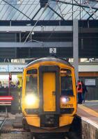 Diesel under the (still partly insulated) wires as 158710 prepares to leave for Alloa. Work is progressing on the EGIP electrification but the installation in Queen Street High level is not quite ready yet for energising.<br><br>[Colin McDonald 25/01/2017]