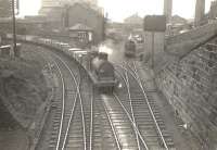 Ex-Caledonian 0-6-0 57603 passing West Street Junction on 29 March 1956 with an eastbound goods train on the approach from Terminus Junction. To the right is the remains of the 1840 P&G route to Windmillcroft Quay, a replacement for the Govan Waggonway of the 1770s. [Ref query 630]   <br><br>[G H Robin collection by courtesy of the Mitchell Library, Glasgow 29/03/1956]