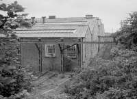 The north east corner of Townhill Wagon Shops after closure. Unsure of the purpose of the gantry and rails. 1986.<br><br>[Bill Roberton //1986]