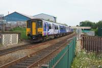 A Northern service to Buxton has departed from Chorley heading towards Bolton on 03 June 2016. The former goods yard was on the right but part of it is now used as a car park.<br><br>[John McIntyre 03/06/2016]