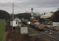 The Blackpool line is closed each weekend between 21st January and 2nd April 2017 for electrification work. On 28th January, 66610 stands on the Up Line by Salwick signal box while its engineering train is loaded with spoil.<br><br>[Mark Bartlett 28/01/2017]
