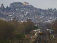 View from the A91 overbridge as a mid afternoon Edinburgh - Dunblane service approaches the St. Ninian's foot crossing as it heads towards Stirling in January 2017. Vegetation clearance has been taking place in preparation for electrification work. <br><br>[Colin McDonald 30/01/2017]