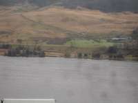 Looking south across Woodhead Reservoir, from the A6024 Woodhead Road running from Holmfirth to the A628, showing the trackbed of the former Woodhead line, now part of the Trans-Pennine Trail, running across the centre of the view at the far side of the reservoir. Woodhead station was along to the left and Crowden Station a short distance to the right. <br><br>[David Pesterfield 18/01/2017]