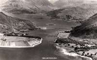 View over Ballachulish Ferry and up Loch Leven. The ferry is midway across to North Ballachulish and the railway can be seen on the right running to Ballachulish. The Ballachulish Bridge would now dominate this picture.<br><br>[Ewan Crawford Collection //]