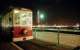 Diesel tram parked at the Theatre end of the short pier tramway (1991 - 2004) with a notable tower in the backdrop. <br><br>[Ewan Crawford //2001]