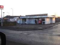 Late January afternoon grab shot from vehicle standing at traffic lights, showing the rather unimposing station building at Sheerness on Sea. The station is the terminus of the branch line running north onto the Isle of Sheppey from Sittingbourne, via Kemsley and Swale stations. <br><br>[David Pesterfield 24/01/2017]