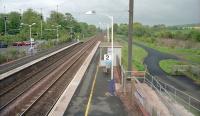 View east from the footbridge at Longniddry towards the former junction for Haddington. There is a proposal in the <a target=external  href=http://www.raildeliverygroup.com/about-us/publications.html?task=file.download&id=469771815>Rail Delivery Group document [PDF]</a> (proposal 16) for quadrupling between Prestonpans and Drem. Here the former trackbed is relatively intact but for much of the length new land would be needed.<br><br>[Ewan Crawford //2001]