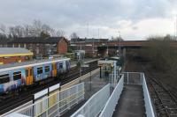 Merseyrail 508111, in <I>Beatles Story</I> vinyls, pauses at Aintree on its way to Liverpool Central. To the right of the Ormskirk platform the tracks to the long abandoned excursion platforms are still in situ but very overgrown in places.<br><br>[Mark Bartlett 07/02/2017]