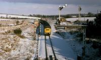 The North Wind Doth Blow.<br>
40061 comes off the Highland line at Stanley Junction. with an Inverness - Edinburgh service.  The remnants of the Strathmore route to Forfar and Kinnaber Junction bear away to the right.  11th February 1978. The unused post on the bracket to the right belonged to the Strathmore route before track rationalisation.<br><br>[Graeme Blair 11/02/1978]