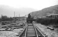 On a dull December day in 1973, looking south over the worksite before the team turned up, at the location of what a few years later would become Aviemore Speyside station. To the right of the crane is Aviemore (North) SB and out of view to the left is Aviemore shed.<br><br>[John McIntyre 29/12/1973]