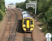 A returning Fife Circle train heads south past the loops at Dalmeny on 22 August 2011. Meantime, the 1118 Edinburgh - Cowdenbeath has just arrived at platform 2 of Dalmeny station in the background.<br><br>[John Furnevel 22/08/2011]