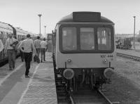 107 444 at Rosyth Dockyard Platform with the 'Forth Tay Venturer' on 16 June 1984, happily coinciding with 'Navy Day'. On the right is one of the resident Planet shunters. The platform was a little to the west of today's shed building.<br><br>[Bill Roberton 16/06/1984]