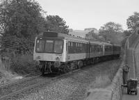 107 029 passes the cramped site of Newburgh (First) with an Edinburgh - Perth service.<br><br>[Bill Roberton //1990]