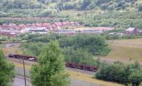 A train of empty coil wagons on the reversing spur above the new yard at Ebbw Vale Steelworks (the yard can be seen above the train). The remaining part of the works was to the right. View looks south west.<br><br>[Ewan Crawford //2001]