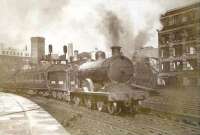 Ex-Caledonian 4-4-0 no 54440 leaving St Enoch on the last day of September 1948 with the 12.30pm local service to Barrhead.  <br><br>[G H Robin collection by courtesy of the Mitchell Library, Glasgow 30/09/1948]